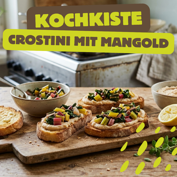 KI generiert: Crostini mit Mangold auf Holzbrett in Küche.  
Text: "KOCHKISTE CROSTINI MIT MANGOLD"