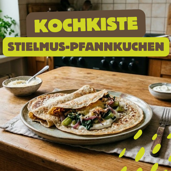 KI generiert: Pfannkuchen mit Stielmus auf einem Tisch. Text: "KOCHKISTE STIELMUS-PFANNKUCHEN".